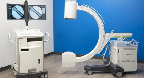 A C-arm with its monitor cart, front view